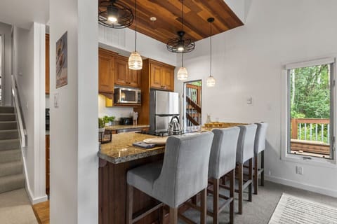 Entertain effortlessly in this open-concept kitchen with seating for four at the bar