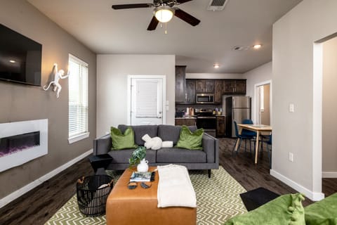 Cozy up by the fireplace and use the 50" Roku Smart TV for movie nights!