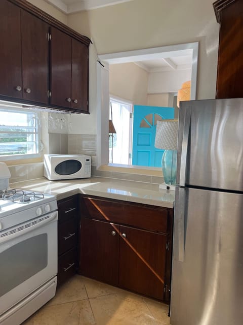 Full sized Refrigerator and stove - plus bonus pass thru window to dining area.