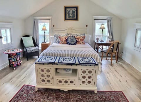 Queen size Tempurpedic bed surrounded by crochet creations made by local artist Gina Gallina.