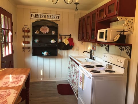The kitchen is fully furnished with a stove, full size fridge and microwave.