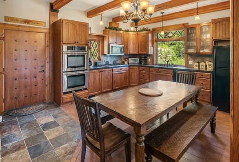 Open kitchen layout with dining room table.