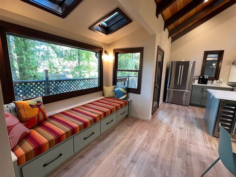 Entry to kitchen/dining with a custom window bench, a favorite spot with guests