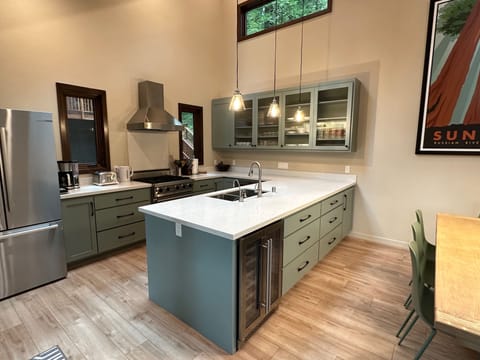 Chef's kitchen with Viking gas stove, dishwasher, microwave oven, wine fridge