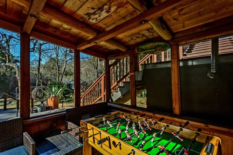 Foosball table sits in an outdoor screened room