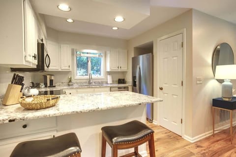 Bar seating for extra dining space or visiting with the chef