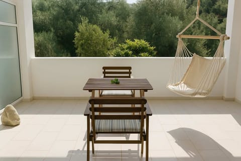 Enjoy the Mountain Views from the Private Balcony with Relaxing Hammock Chairs