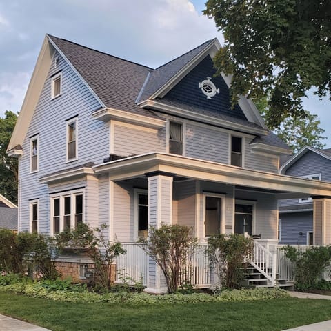 Come home each day to a beautifully restored 1910s Colonial, one of the prettiest houses on the block