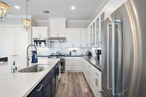 This kitchen is a chef's dream!  The cabinets are full of cookware and bakeware!