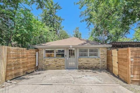 Timeless and elegant home with classic architectural details and a lush front lawn.