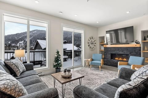 The main living space has a 65 inch smart tv and a bluetooth sound bar. Guests can connect to it and listen to music while enjoying some family and friend time in the cozy setting by the gas fire place. 