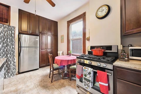Fully equipped kitchen with appliances, pots & essentials.