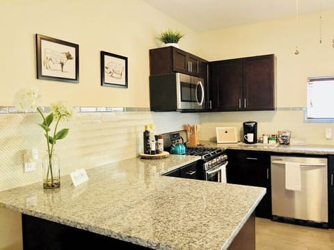 A well-furnished kitchen corner with all amenities to cook delicious meals.