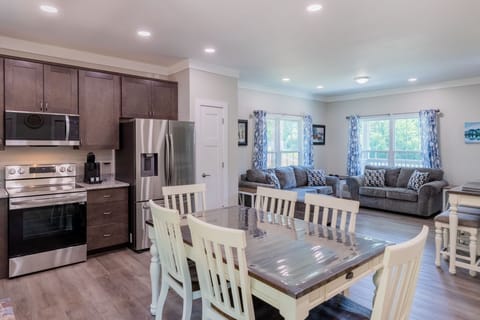 Kitchen - Kitchen with new stainless steel appliances and dining table with seating for 6.
