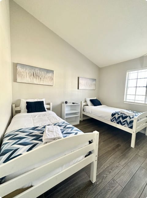 Dream in Blue: Twin Master Bedroom with Touches of Gold for a Restful Night