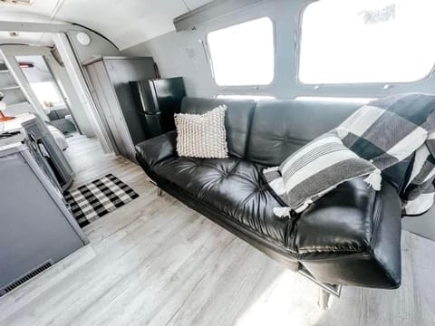 Futon can be folded down to make another bed. 