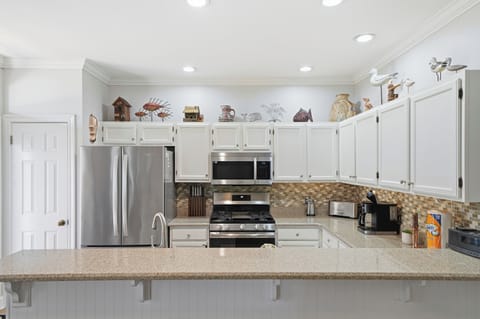 The kitchen offers a central space for socializing with friends and family