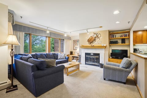 Gather around the fireplace in the comfortable living room after a day on the mountain.