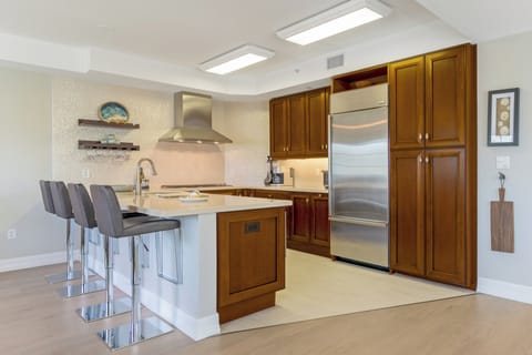 Step into your bright, fully equipped kitchen, ready for everything from a gourmet meal to a simple beach snack.