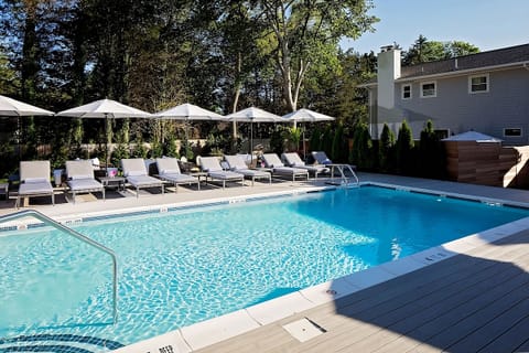 Soak up the sun poolside with loungers and sparkling water.