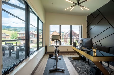 Main level office space with Peloton bike