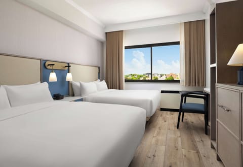Wake up to sunshine and skyline views from plush beds