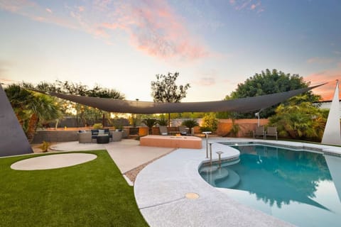Enjoy a peaceful afternoon by the pool in our backyard garden!