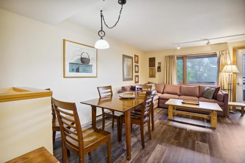 Gather together with an open layout featuring dining space, lounge seating, and natural light throughout.