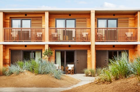Arrive to warm wood architecture with private balcony moments.