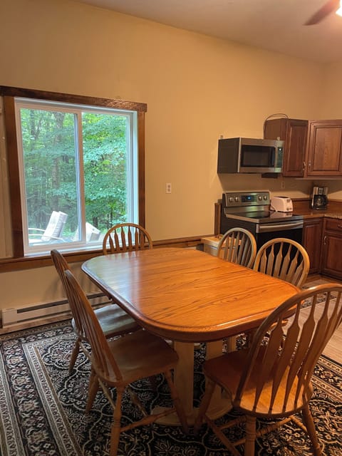 Dining Area with picturesque view of Adirondack woods