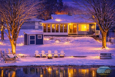 Lakeside view of the home in the winter