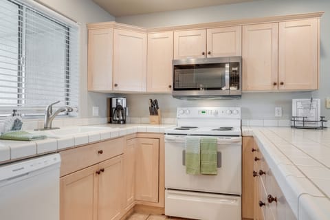 Kitchen | Spacious Breakfast Bar | High Chair | Refrigerator