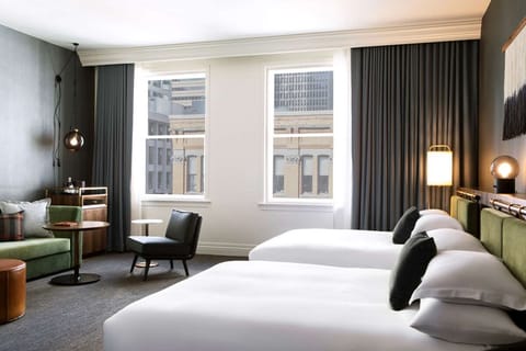 Stretch out with two plush beds and a relaxed lounge corner.