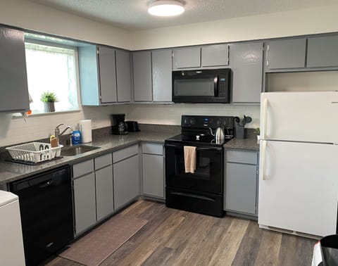 Kitchen essentials include drip coffee maker, kettle, toaster, crockpot, & more.