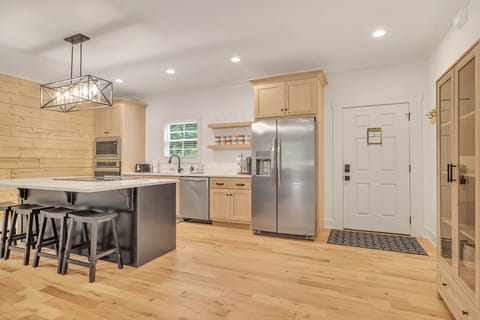 Beautiful gourmet kitchen and front door.