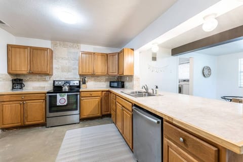  Culinary Haven!  Kitchen boasts electrical appliances: garbage disposal, oven, stove, dishwasher, and microwave. Large fridge with filtered water & ice machine. Everything you need to whip up delicious meals! 
