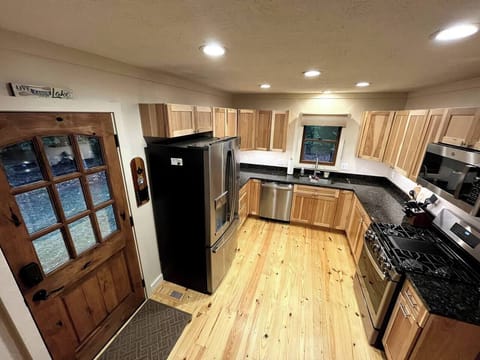 Side door opens to hallway to bathrooms and main level bedroom.