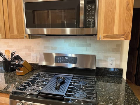 High end gas stove and oven. Microwave with air fryer option.