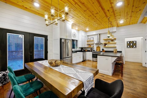 The living room seamlessly flows into the kitchen/dining area.