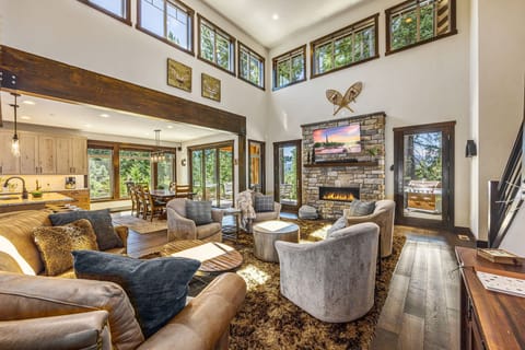 Vaulted Living Room w/ Stone Gas Fireplace + Designer Furnishings