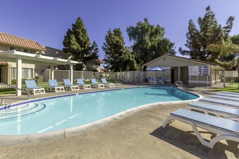 Stretch out on sun loungers after a cooling swim.