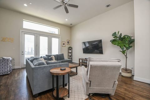 Spacious living room with large flat screen smart TV
