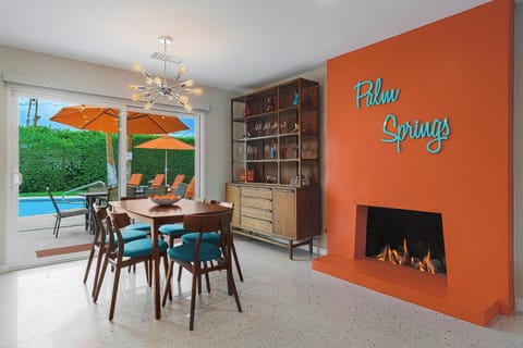 Fun dining room with vibrant gas fireplace and vintage buffet/bar
