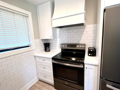 A clean, crisp kitchen with new appliances makes cooking a joy!