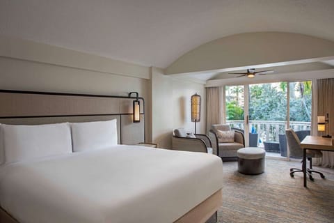 Drift off peacefully in a calm room with private balcony.