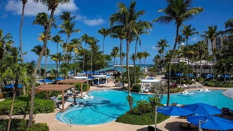 Dive into sparkling turquoise waters with ocean breezes nearby.