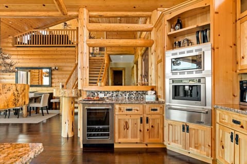 The kitchen has beautiful granite counter tops, a wine fridge and stainless-steel appliances.