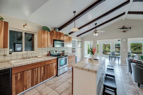 Additional seating offered at the kitchen island behind the living room