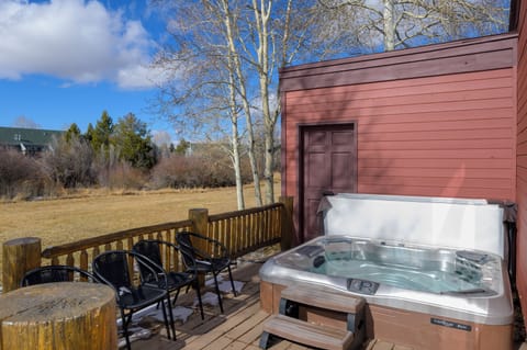 Soak in your private hot tub while mountain views stretch before you, creating the perfect backdrop for relaxation.