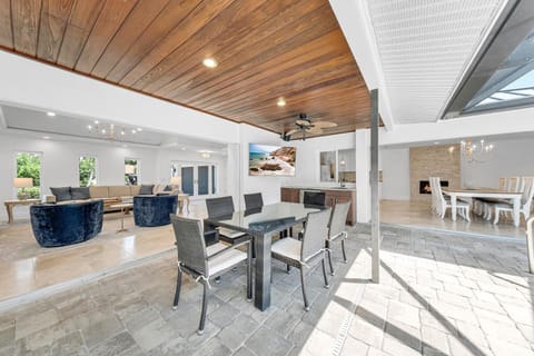 Outdoor Dining with TV visible from pool